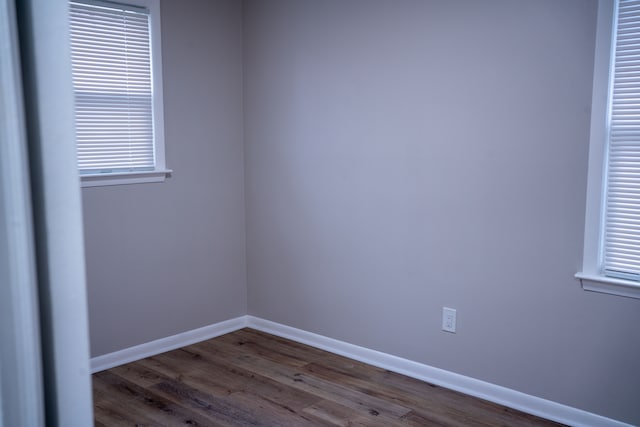 spare room with hardwood / wood-style flooring