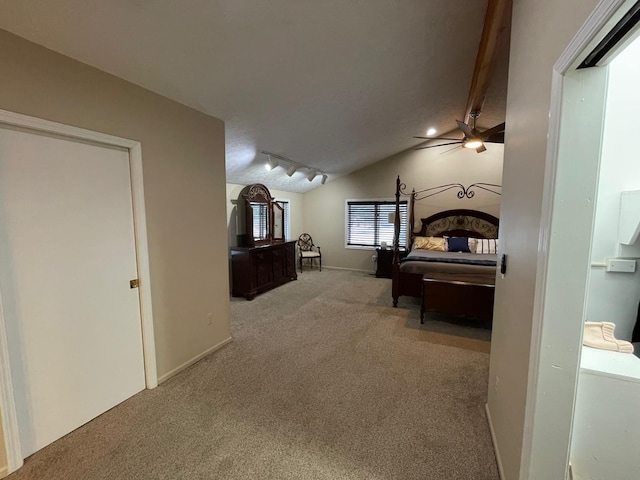 carpeted bedroom featuring vaulted ceiling with beams