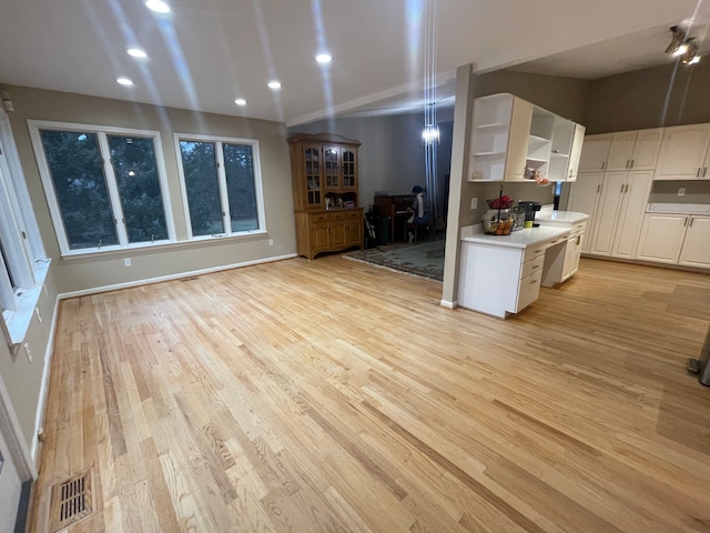 kitchen featuring light hardwood / wood-style flooring and white cabinets