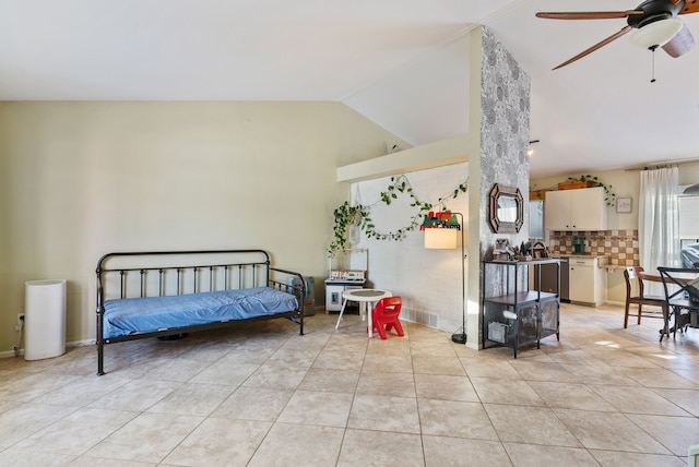 interior space with light tile patterned floors, high vaulted ceiling, and ceiling fan