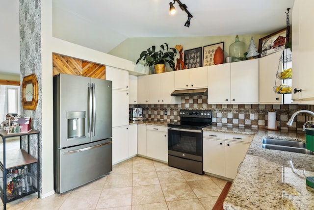 kitchen featuring white cabinets, stainless steel appliances, light stone countertops, and sink