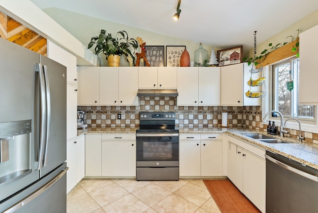 kitchen featuring sink, white cabinets, vaulted ceiling, and appliances with stainless steel finishes