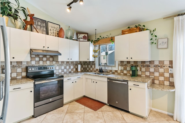 kitchen featuring appliances with stainless steel finishes, backsplash, white cabinetry, and sink