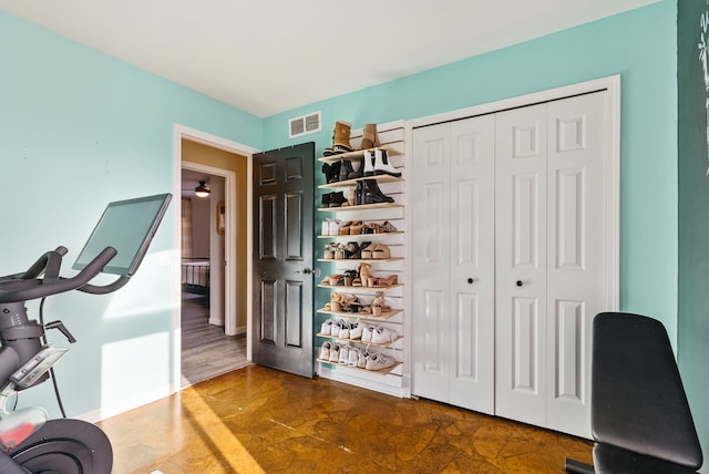 office area with dark hardwood / wood-style flooring and ceiling fan