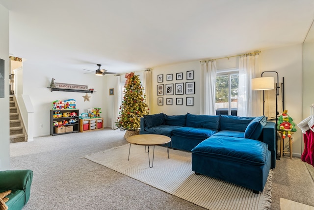 living room featuring carpet and ceiling fan