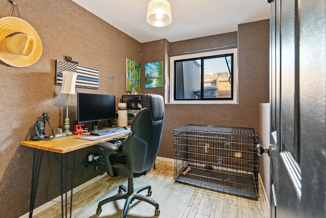 office with light hardwood / wood-style flooring