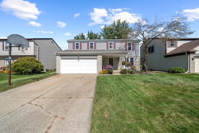 view of property with a garage and a front yard