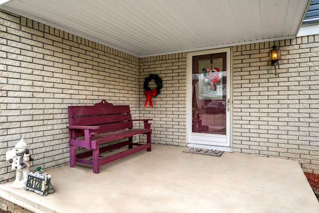 entrance to property featuring covered porch