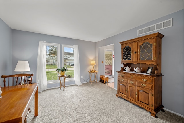 sitting room with light colored carpet