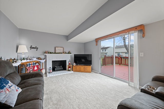 living room featuring a fireplace and carpet floors