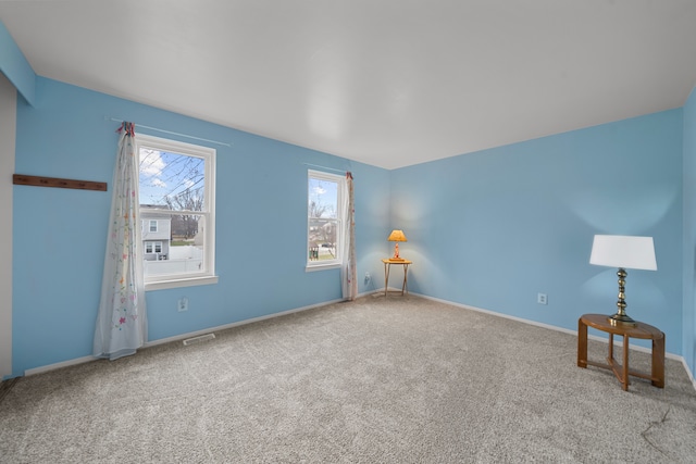 view of carpeted spare room