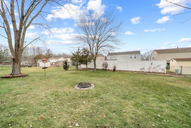 view of yard with an outdoor fire pit