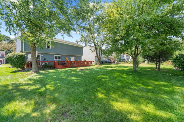 view of yard featuring a wooden deck