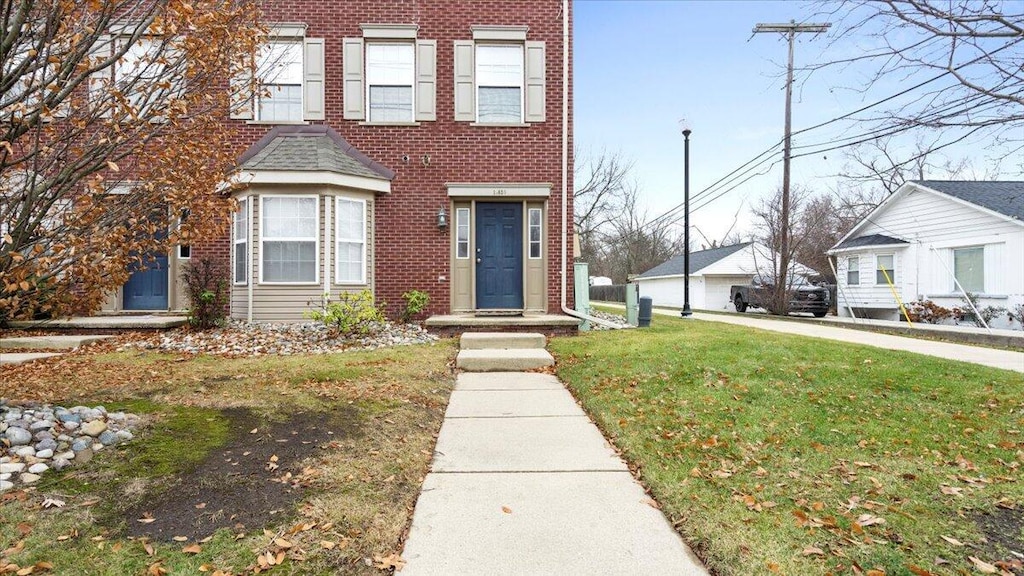 view of property featuring a front yard