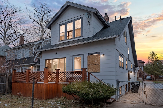 view of back house at dusk