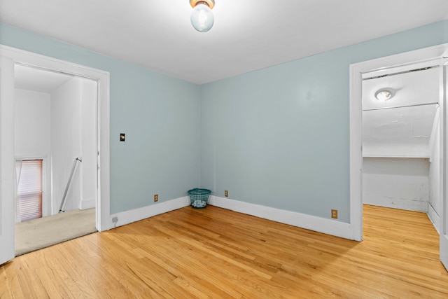 spare room featuring hardwood / wood-style floors