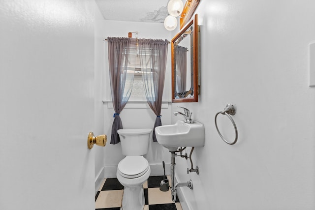 bathroom with toilet and sink