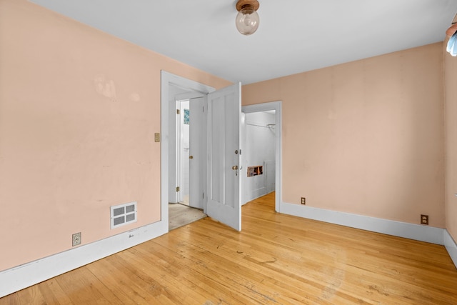 empty room with light wood-type flooring