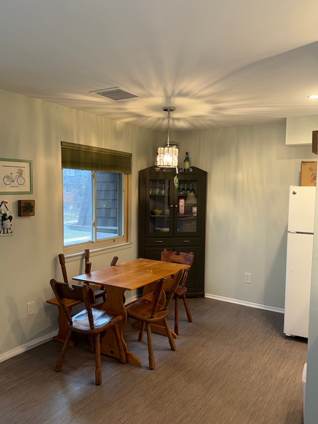 dining area featuring a chandelier