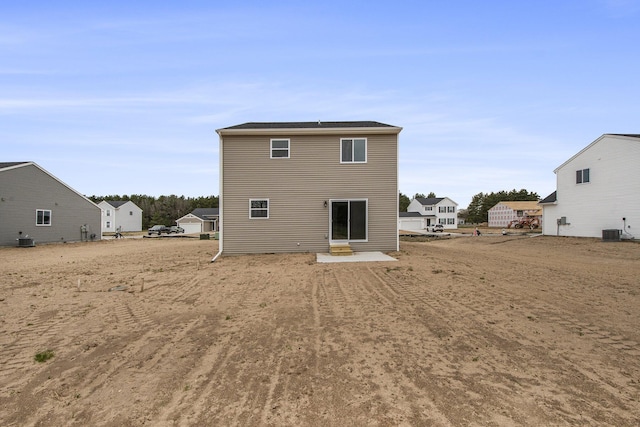 rear view of house with cooling unit and entry steps