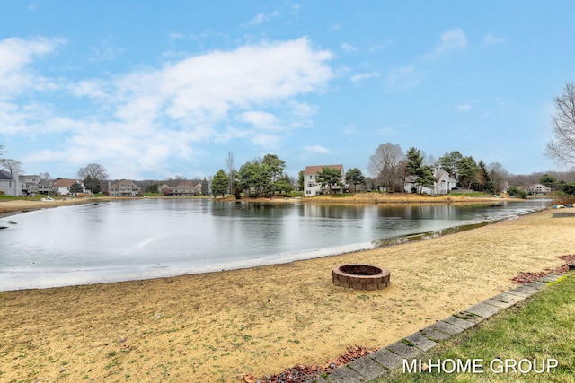 property view of water featuring a fire pit