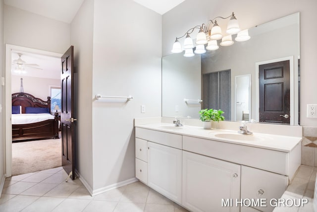 bathroom with tile patterned floors, ceiling fan, and vanity