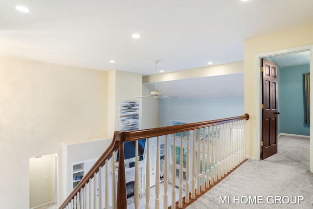 hallway with light carpet