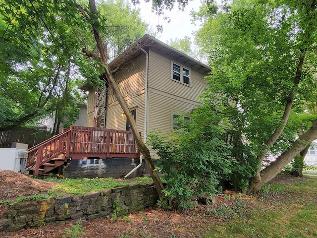 back of property with a deck