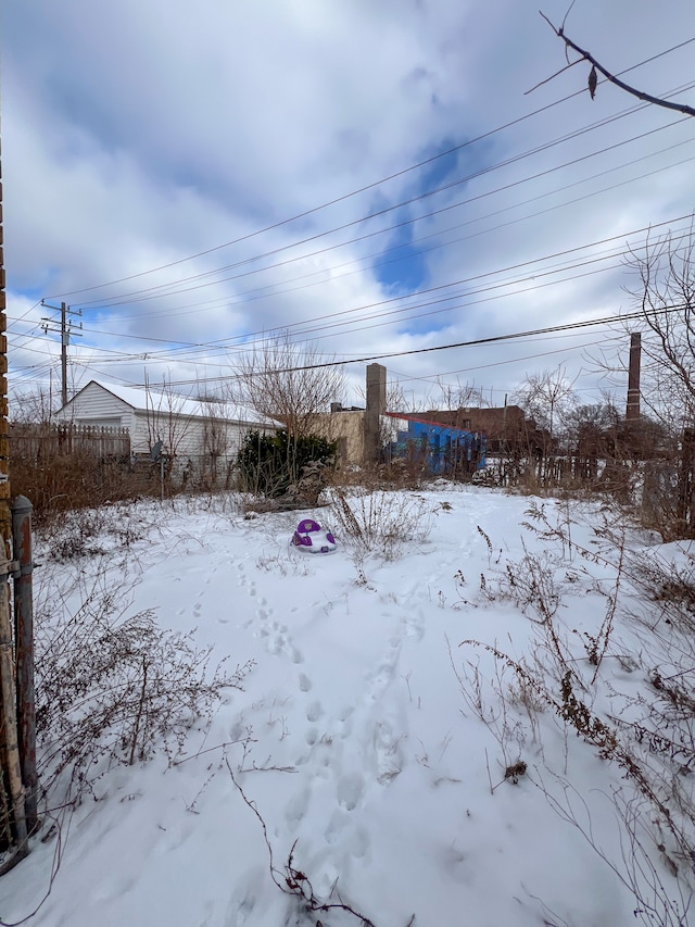 view of yard covered in snow