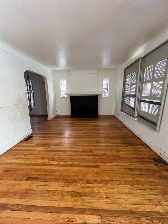 unfurnished living room with hardwood / wood-style floors