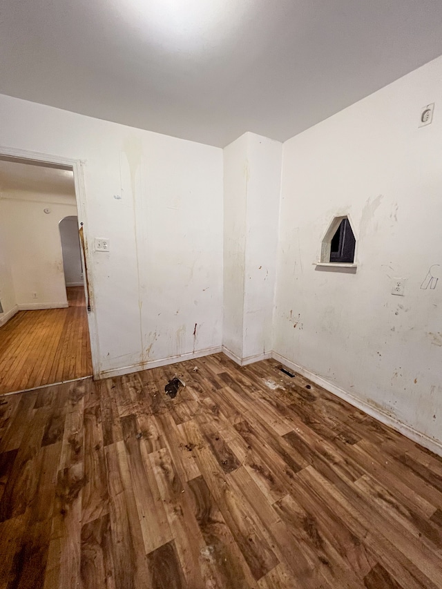 laundry area with wood-type flooring