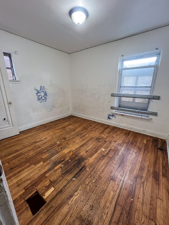 empty room with hardwood / wood-style floors