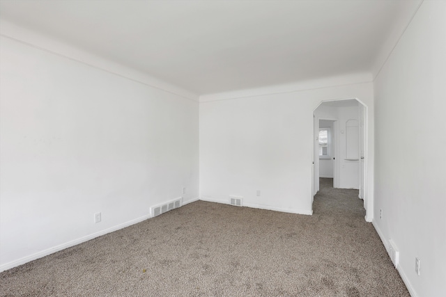 19723 Carrie St, Detroit, MI 48234 - unfurnished room with carpet floors and arched walkways