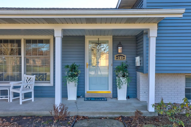 property entrance with covered porch