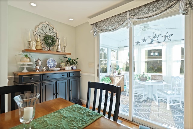 dining room featuring hardwood / wood-style floors and ceiling fan