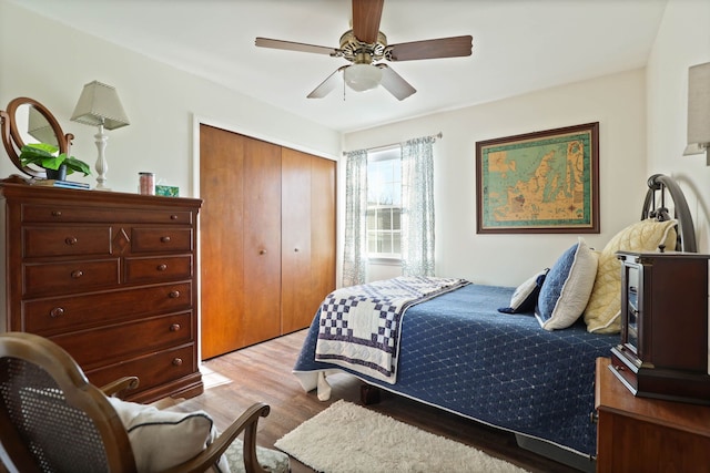 bedroom featuring a closet, ceiling fan, and light hardwood / wood-style flooring