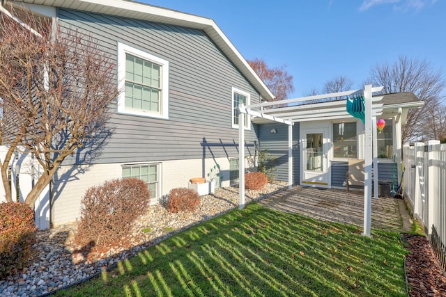 exterior space featuring a yard and a pergola