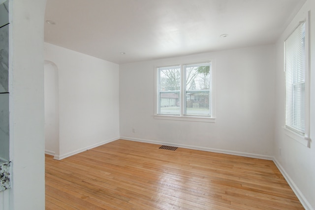 unfurnished room featuring light wood-type flooring