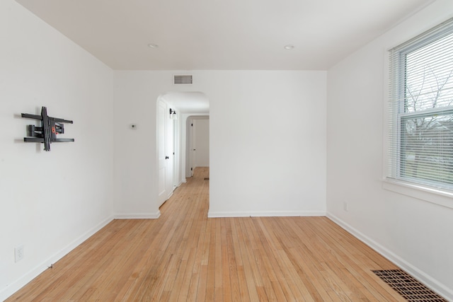 unfurnished room with light hardwood / wood-style floors