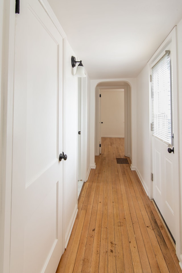 hallway featuring light hardwood / wood-style flooring