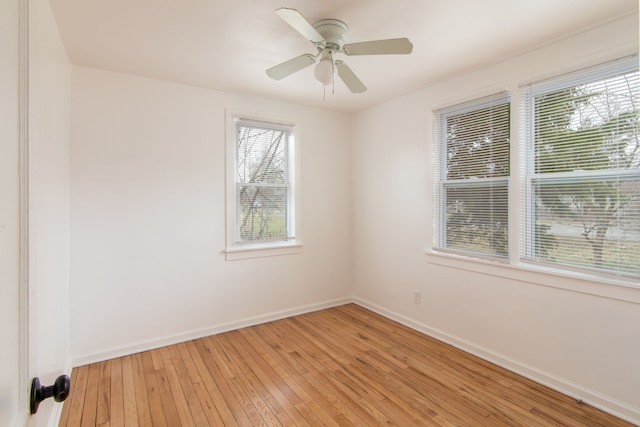 spare room featuring light wood-type flooring and ceiling fan