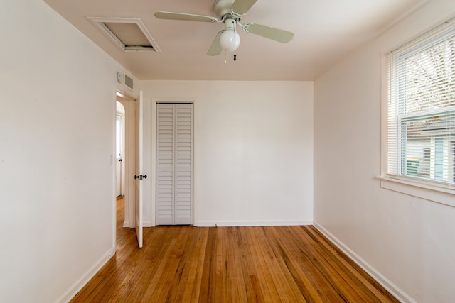 unfurnished room with ceiling fan and light hardwood / wood-style floors