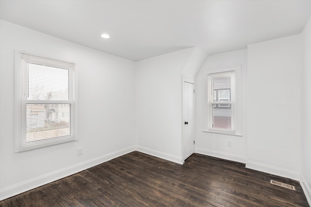 empty room with dark hardwood / wood-style floors