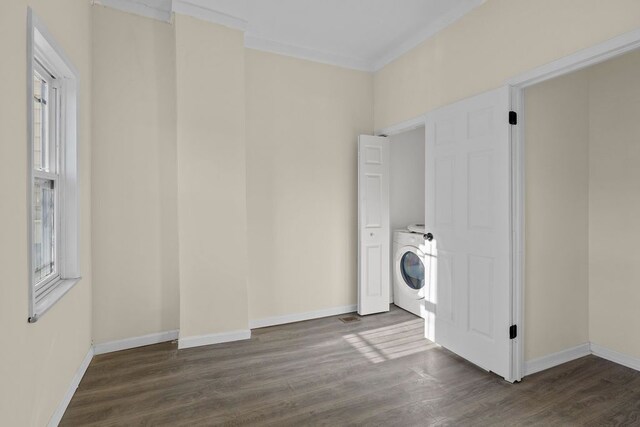 washroom with washer / clothes dryer, crown molding, and dark hardwood / wood-style floors