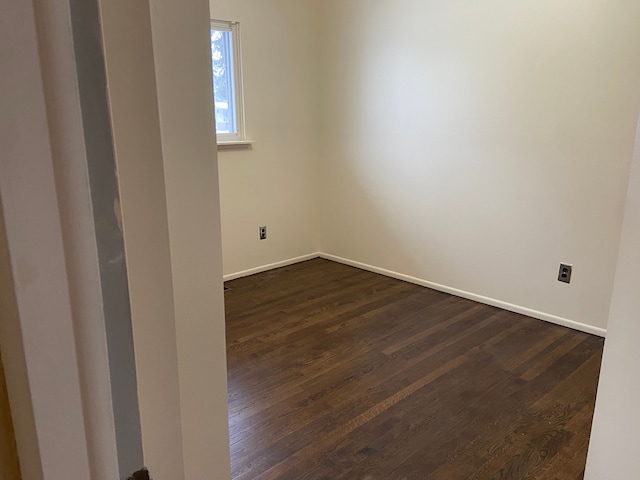 unfurnished room featuring dark hardwood / wood-style floors