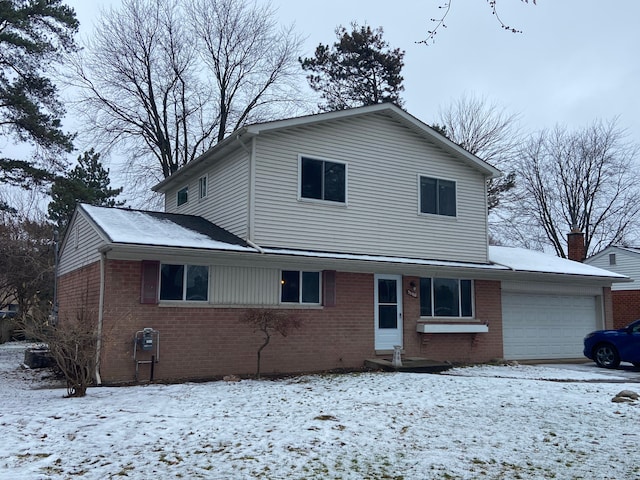 front of property with a garage