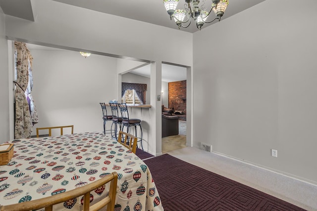 bedroom with vaulted ceiling, light colored carpet, and an inviting chandelier