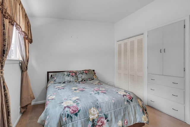 carpeted bedroom with a closet