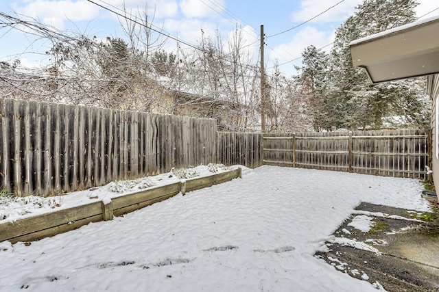 view of yard layered in snow