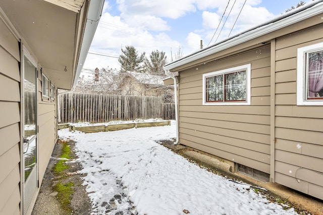 view of yard layered in snow